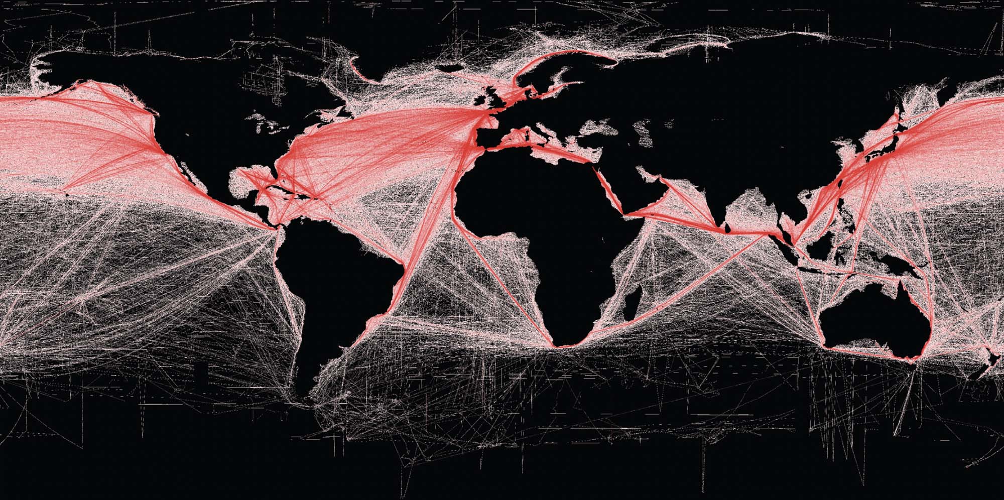 Thin, red lines indicate global shipping routes on a world map.