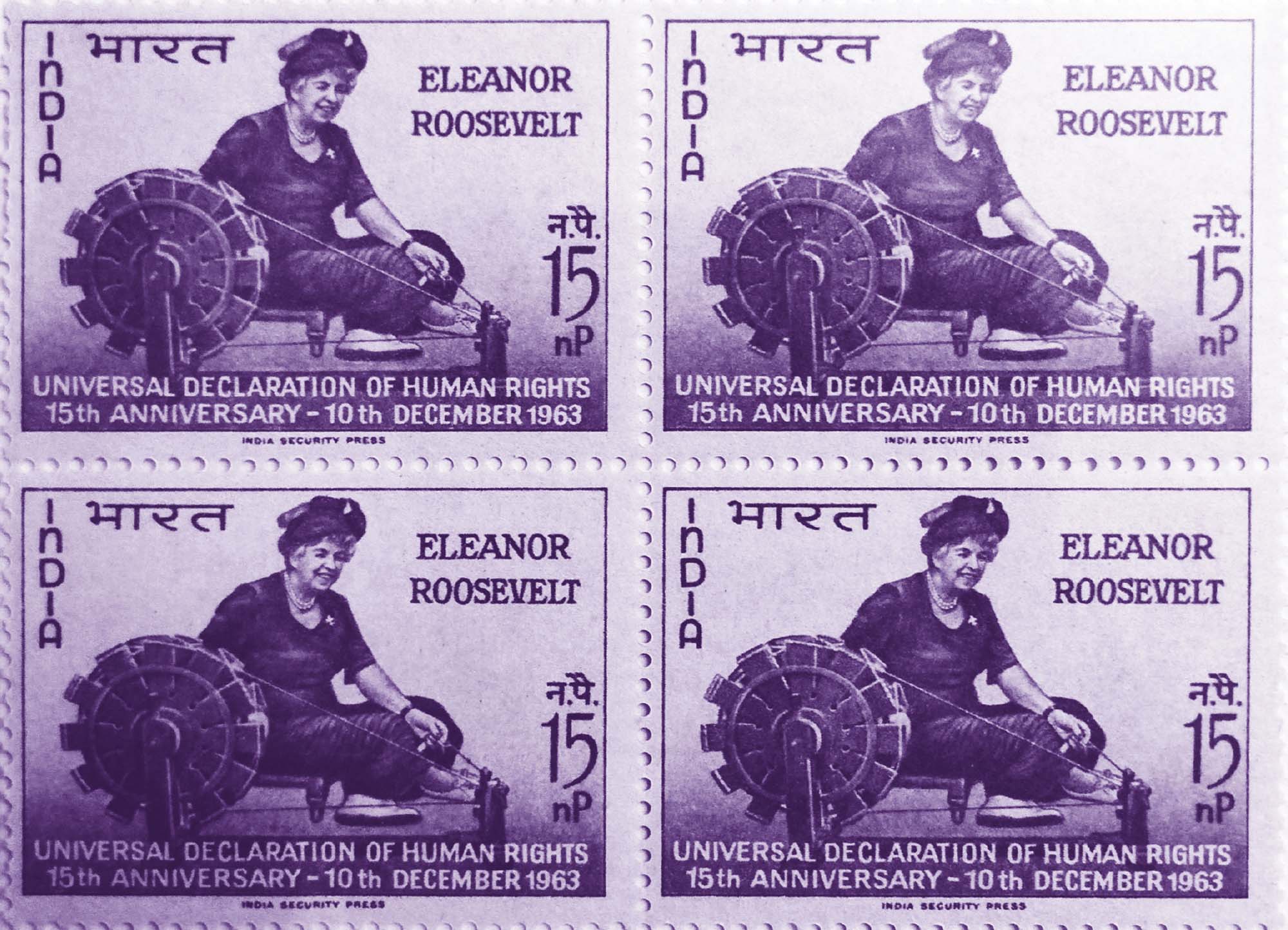 Photo of four stamps that show Eleanor Roosevelt using a spinning wheel. “Universal Declaration of Human Rights 15th Anniversary – 10th December 1963” is written at the bottom.